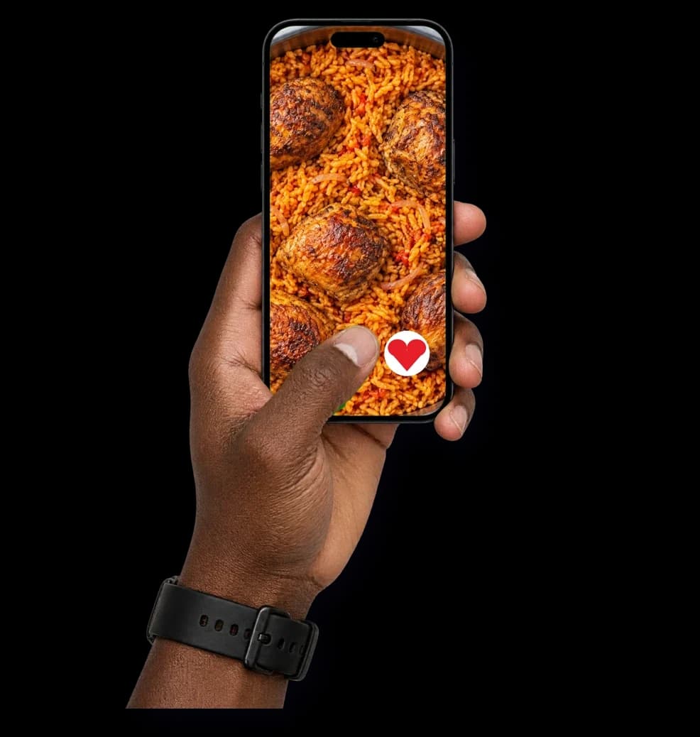 A thumb tapping a heart to vote on a phone showing jollof rice