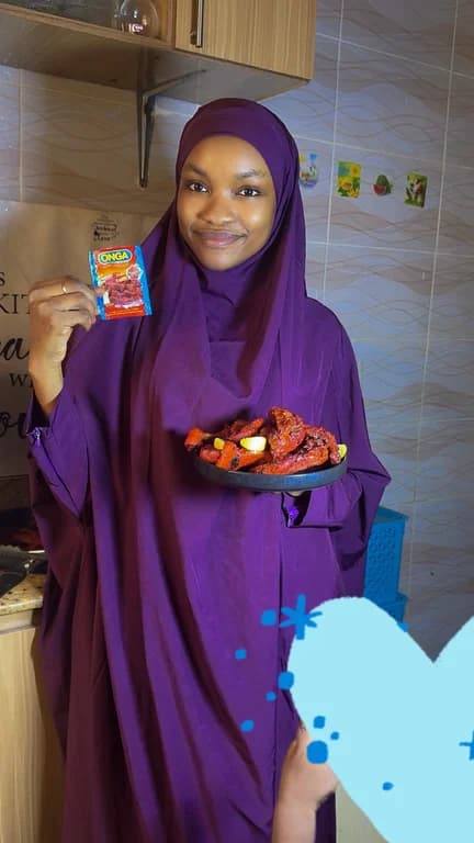 Abubakar Rahama with My grilled chicken with onga stew